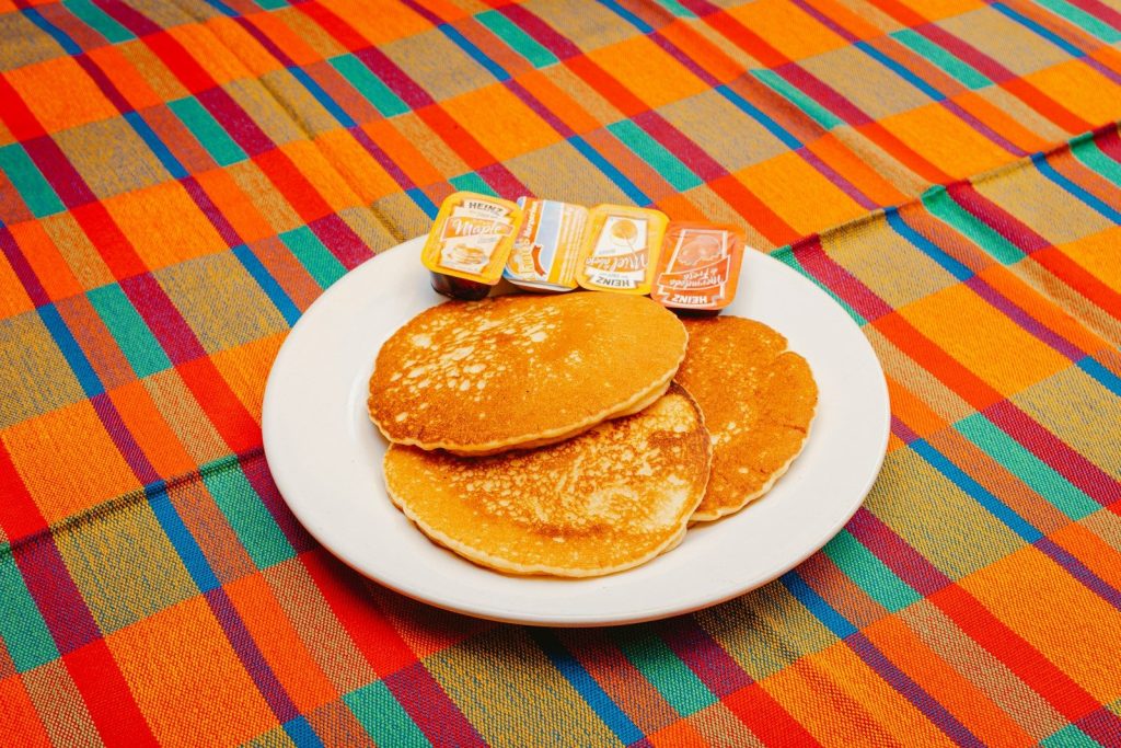 A plate of pancakes with blocks spelling out the word b is for b is for