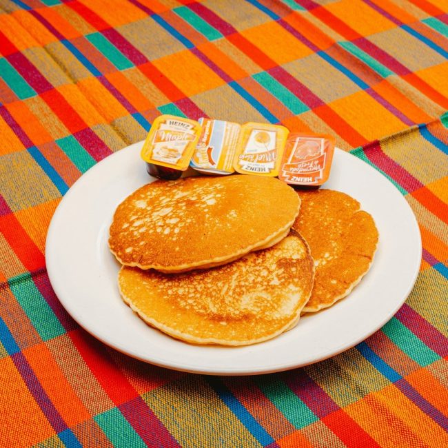 A plate of pancakes with blocks spelling out the word b is for b is for