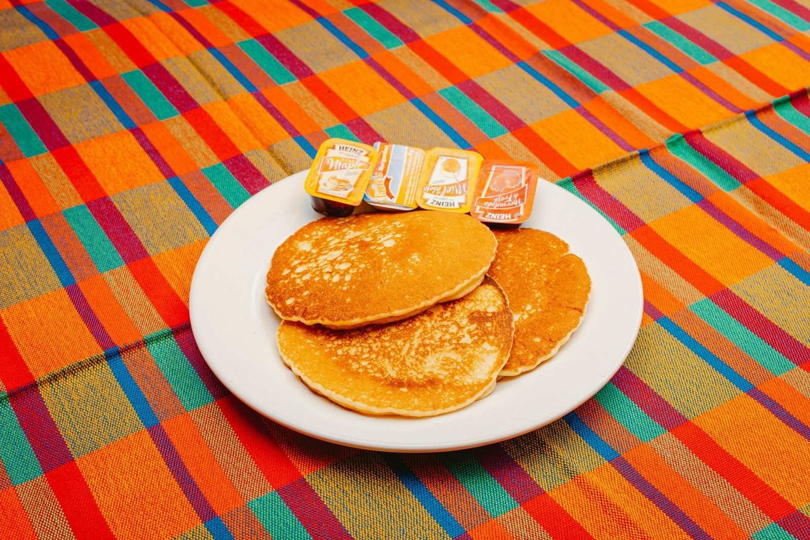 A plate of pancakes with blocks spelling out the word b is for b is for